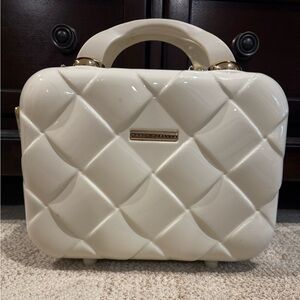 Marcy McKenna cream colored travel makeup-accessories case